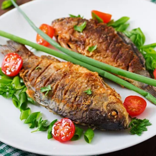 fried fish carp and fresh vedSalad